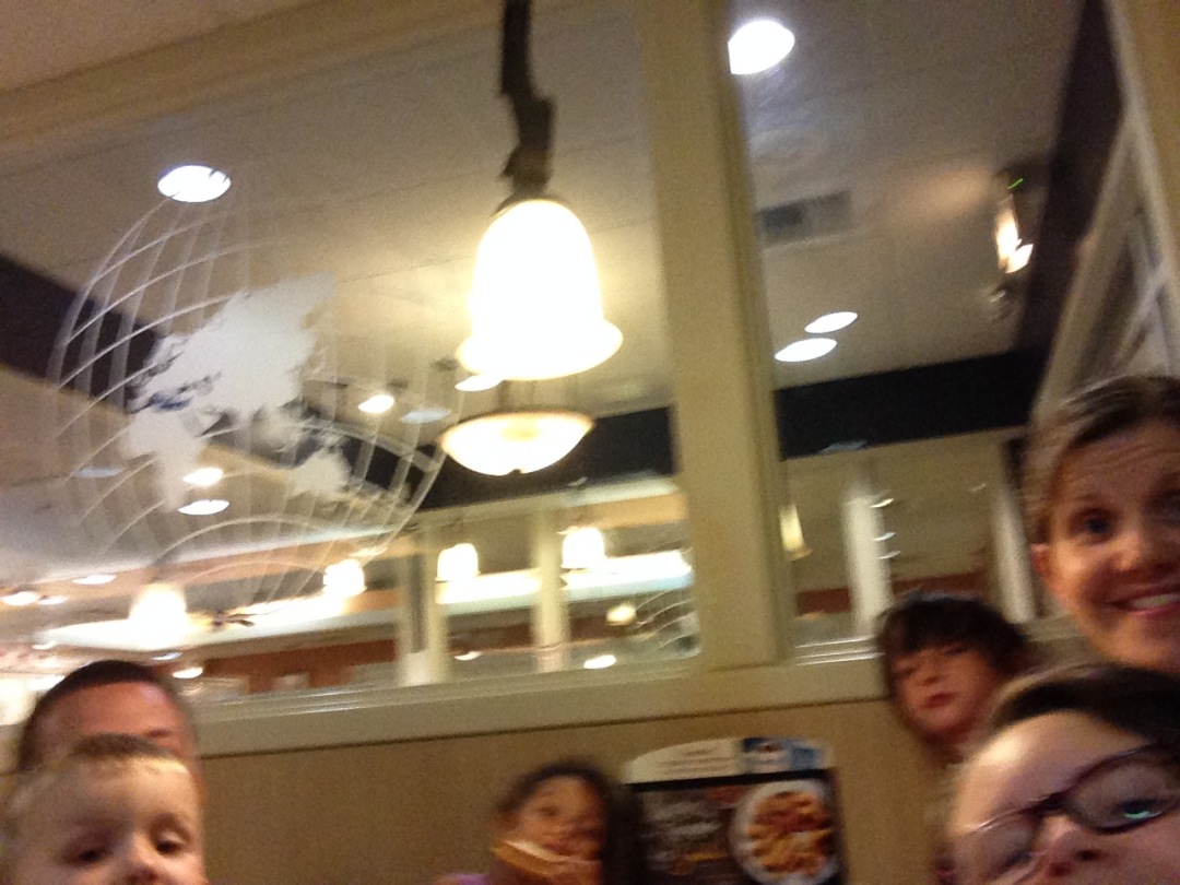 EL attempts to do a family selfie at IHOP - our dinner stop for the night
