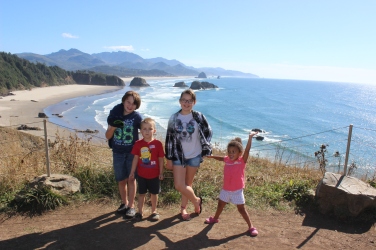 The kids with Haystack Rock in the background